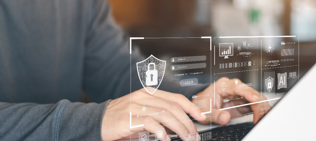 Mans sobre o teclado dun portátil