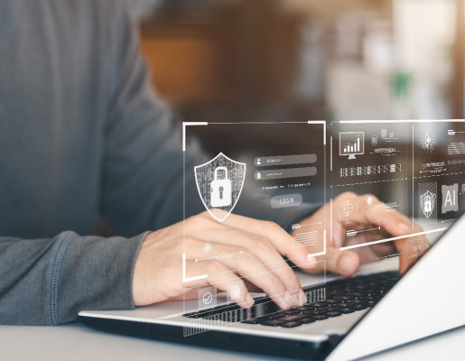 Mans sobre o teclado dun portátil